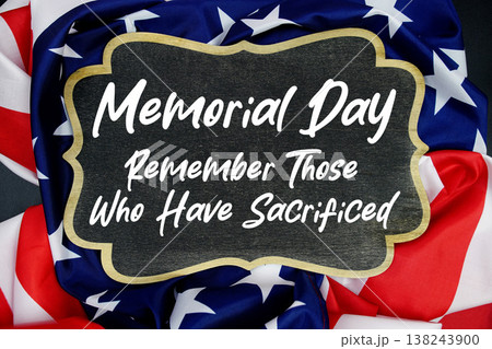Happy Memorial Day written on blackboard with USA flag background 138243900