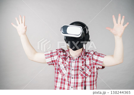 Gamer man wearing VR Gamer man wearing VR 138244365