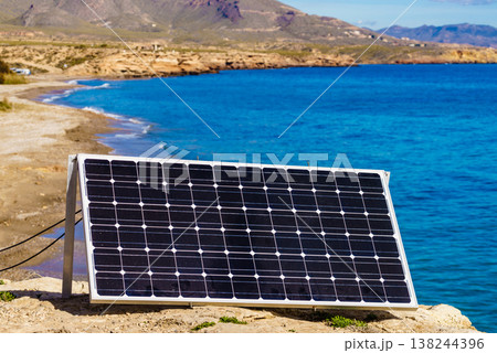 Solar photovoltaic rigid panel outdoors on sea shore 138244396