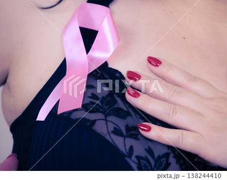 Woman chest in bra, pink cancer ribbon Woman chest in bra, pink cancer ribbon 138244410