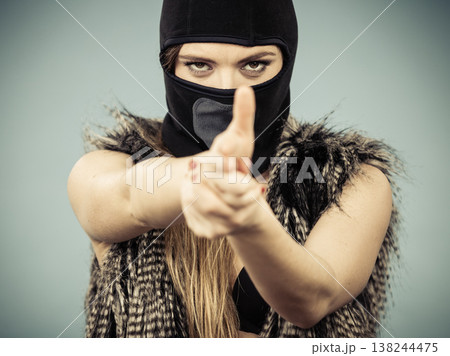 Woman sexy girl in balaclava, crime and violence Woman sexy girl in balaclava, crime and violence 138244475