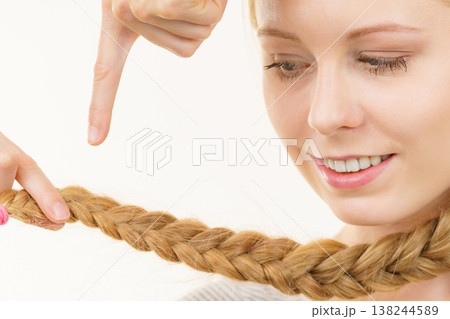 Blonde young woman with braid hair 138244589