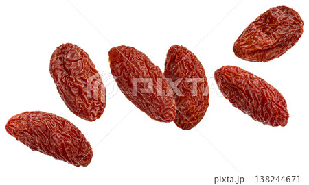 Falling dried goji berries isolated on white background, full depth of field 138244671