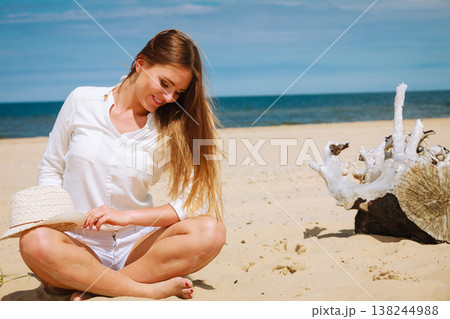 Female tourist resting on beach. Female tourist resting on beach. 138244988