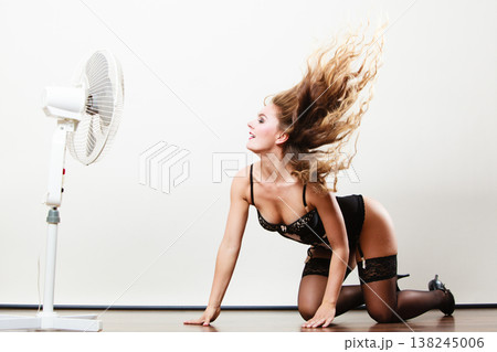 Sexy woman playing with fan. Sexy woman playing with fan. 138245006