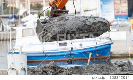 Excavator shovel digging in sand from water Excavator shovel digging in sand from water 138245014