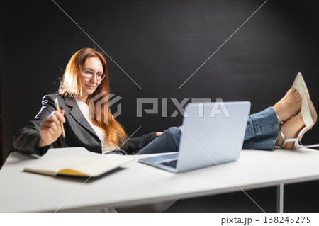 Casual businesswoman working enjoying comfort and flexibility Casual businesswoman working enjoying comfort and flexibility 138245275
