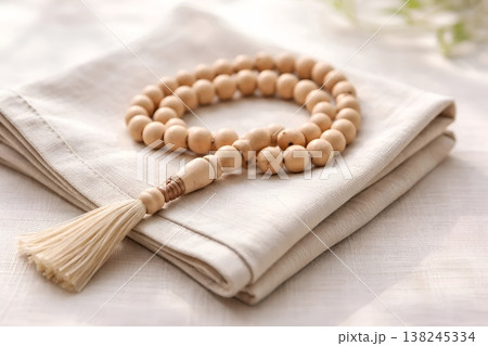 Prayer Beads on Linen Napkin Close-Up Minimal Bright Spiritual Background 138245334