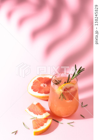 Summer cocktail with grapefruit, rosemary, and ice. Summer cocktail with grapefruit, rosemary, and ice. 138245829