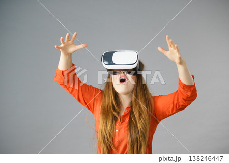 Girl wearing virtual reality goggles. Girl wearing virtual reality goggles. 138246447