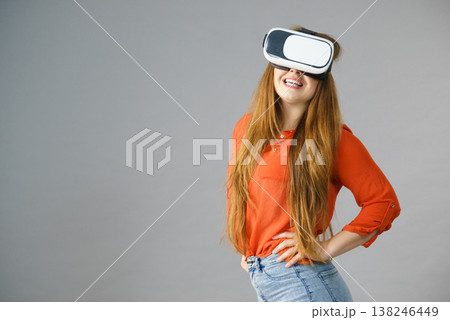 Girl wearing virtual reality goggles. Girl wearing virtual reality goggles. 138246449