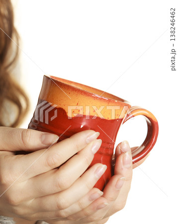 Woman holding red tea coffee mug Woman holding red tea coffee mug 138246462