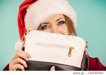 Christmas girl holding handbag present Christmas girl holding handbag present 138246483