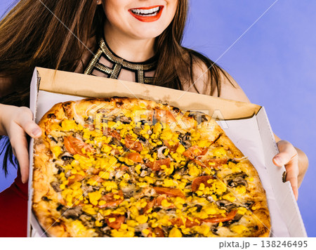 Woman holding big pizza in box Woman holding big pizza in box 138246495