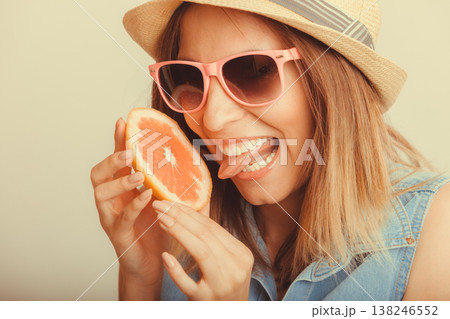 Happy woman in hat drinking grapefruit juice. Diet Happy woman in hat drinking grapefruit juice. Diet 138246552