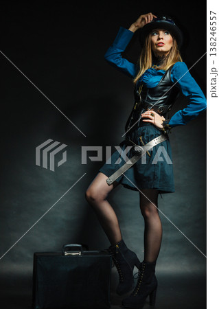 Steampunk girl with retro bag. Steampunk girl with retro bag. 138246557