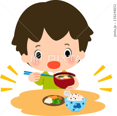 ご飯と漬物と味噌汁の食事を摂る男の子 138248652