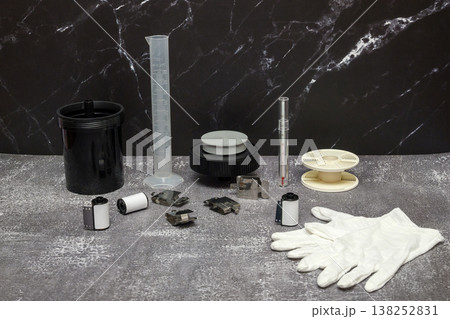 still life photography of accessories for a home photo laboratory on a dark background in interior still life photography of accessories for a home photo laboratory on a dark background in interior 138252831