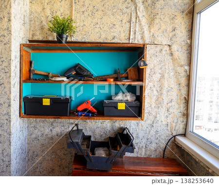 shelf with tools on the balcony 138253640
