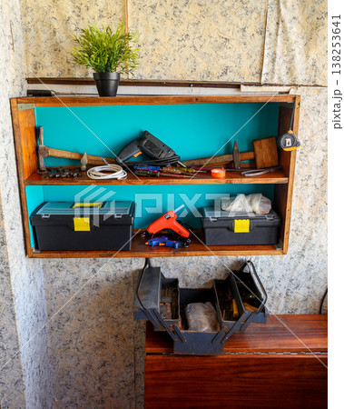 organization of tools on a wall shelf organization of tools on a wall shelf 138253641