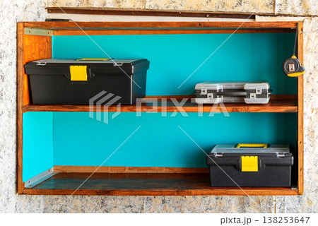tool boxes on a wooden shelf tool boxes on a wooden shelf 138253647
