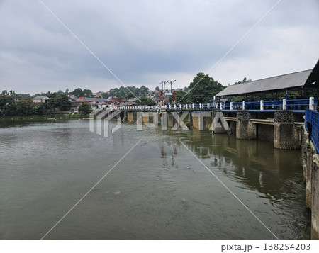 An aerial drone perspective reveals the historic Katulampa Dam spanning the Ciliwung River in Bogor An aerial drone perspective reveals the historic Katulampa Dam spanning the Ciliwung River in Bogor 138254203