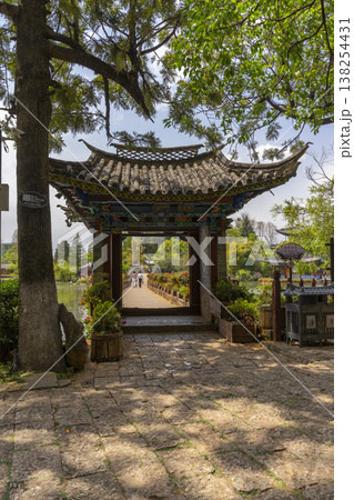 Lijiang, China - April 12, 2024 : : People enjoy weather at Black Dragon Pool Park in Dayan old town in Lijiang Old Town, China on April 12, 2024. 138254431