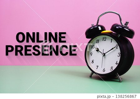 Black alarm clock on a pastel green and pink background with the text "Online Presence" 138256867