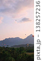 Looking at the rising hot air balloon  138257236