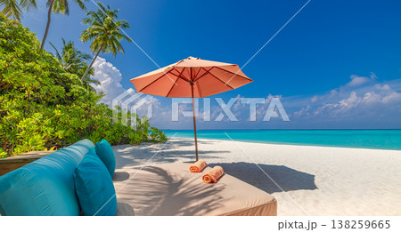 Tropical beach paradise with sun bed canopy, umbrellas, palm trees, and calm ocean, dreamy relaxing summer travel vacation background Tropical beach paradise with sun bed canopy, umbrellas, palm trees, and calm ocean, dreamy relaxing summer travel vacation background 138259665