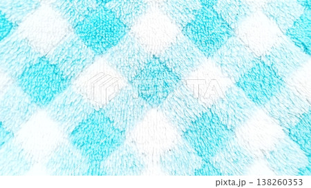 Close-up of a soft and fuzzy fabric texture featuring a cheerful blue and white diamond pattern. Ideal for backgrounds, textiles, or cozy design projects. The plush material provides a comforting Close-up of a soft and fuzzy fabric texture featuring a cheerful blue and white diamond pattern. Ideal for backgrounds, textiles, or cozy design projects. The plush material provides a comforting 138260353