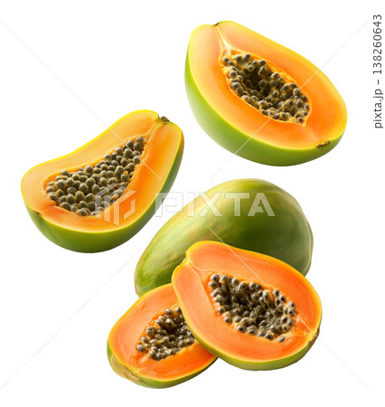 Multiple ripe papaya halves with dark seeds shown isolated on white background, representing a fresh tropical fruit concept 138260643