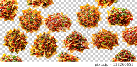 Assorted nachos loaded with fresh ingredients shown isolated on white background representing street food concept Assorted nachos loaded with fresh ingredients shown isolated on white background representing street food concept 138260653