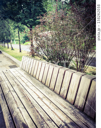 A bench made of wood in close-up.Summer day in the park. 138262038