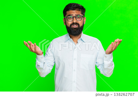 Indian man shrugging with puzzled expression making hands up gesture expressing confusion chroma key Indian man shrugging with puzzled expression making hands up gesture expressing confusion chroma key 138262707