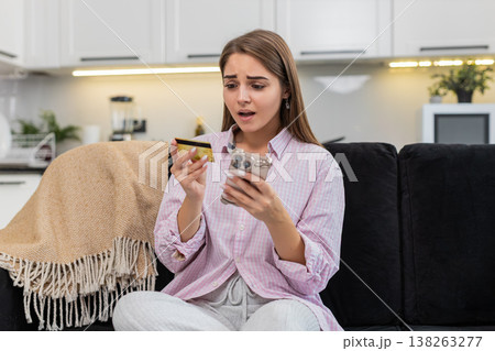 Young woman card declined on mobile payment low balance alert bank panic about fraud with smartphone 138263277