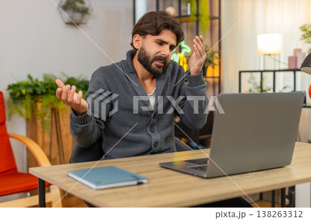 Indian man faces laptop app crash virus glitch error does facepalm annoyed frustrated reaction upset Indian man faces laptop app crash virus glitch error does facepalm annoyed frustrated reaction upset 138263312