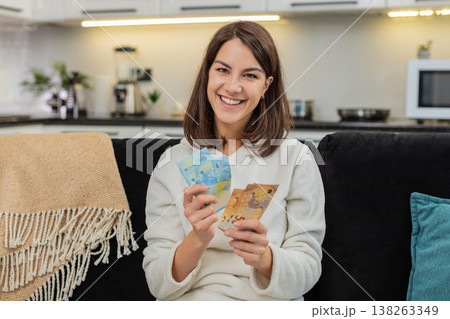 Woman counts euro money cash celebrates high salary and savings plans invest and dream purchase Woman counts euro money cash celebrates high salary and savings plans invest and dream purchase 138263349