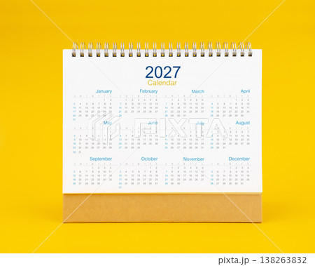 Yearly 2027 desk calendar on yellow color background, Front view. Yearly 2027 desk calendar on yellow color background, Front view. 138263832