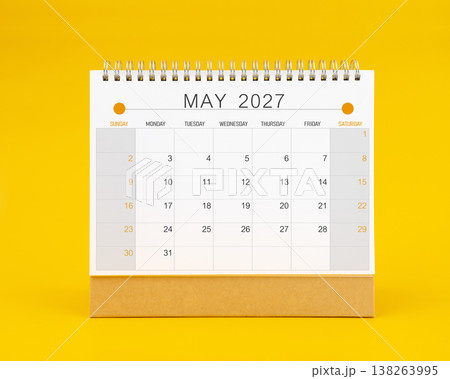 May 2027 desk calendar on yellow color background, Front view. May 2027 desk calendar on yellow color background, Front view. 138263995