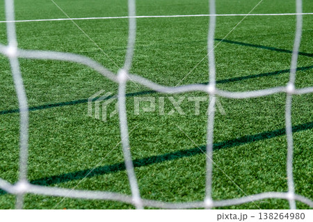 Soccer field green grass and net background. Soccer field green grass and net background. 138264980