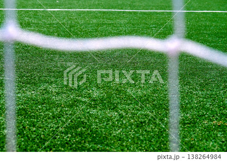 Soccer field green grass and net background. Soccer field green grass and net background. 138264984