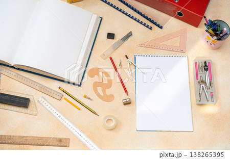 Top View Workspace with Blank Spiral Notebook Rulers and Engineering Drawing Instruments Top View Workspace with Blank Spiral Notebook Rulers and Engineering Drawing Instruments 138265395