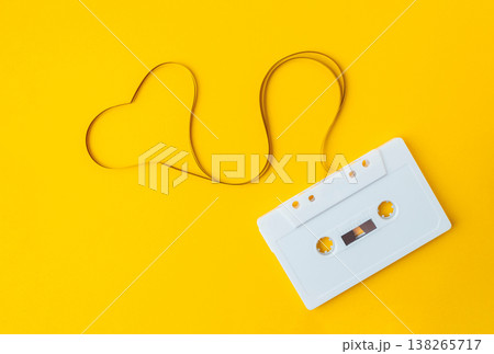 Retro White Cassette Tape on Bright Yellow Background Retro White Cassette Tape on Bright Yellow Background 138265717