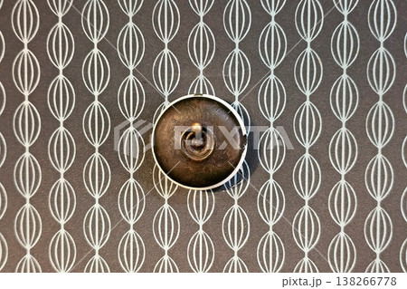 Vintage brass light switch on vintage wall Background. 138266778