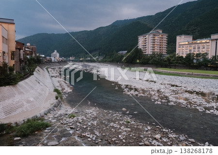 River Flows Through Japanese Mountain Town 138268178