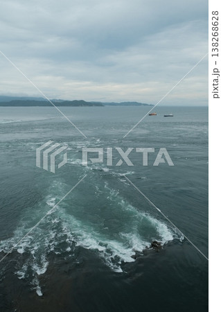 Dramatic Ocean Wave And Distant Boats Dramatic Ocean Wave And Distant Boats 138268628