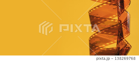 Film strip, twisted and unrolled, creating spiral shape, banner format Film strip, twisted and unrolled, creating spiral shape, banner format 138269768