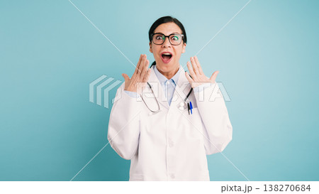Female doctor receiving surprising news with open mouth Female doctor receiving surprising news with open mouth 138270684