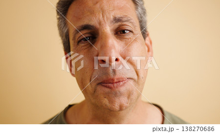 Middle aged man close up portrait with neutral expression 138270686